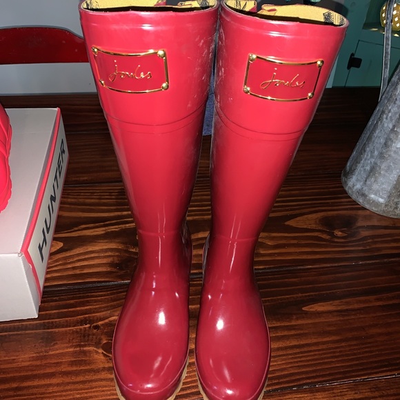 red rain boots with bow on back